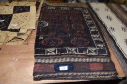 A hand dyed and woven rug wall hanging possibly Afghan or middle eastern