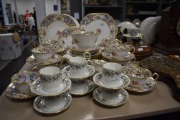 A fine porcelain part tea service having extensive gilt and enamel decoration also a small Chelson