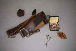 A selection of scout and scouting memorabilia including badges and belt