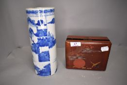 A hard paste Chinese vase decorated in traditional blue and white design also with lacquer case