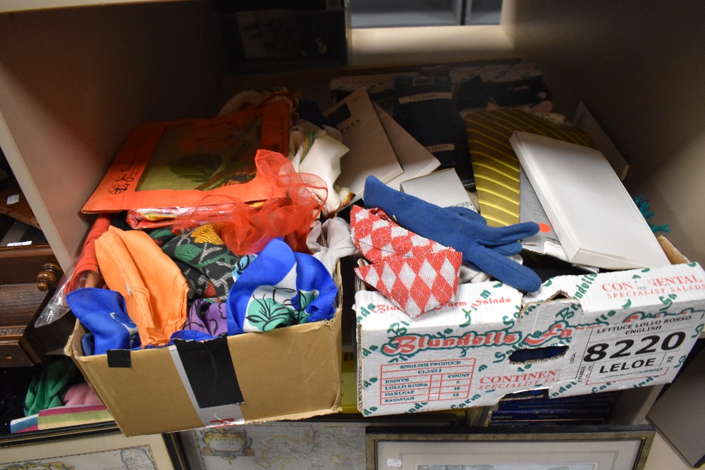 A box of headscarves and tights, various colours and styles.