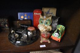 A selection of money box and piggy banks including cast metal coronation crown