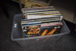 A selection of vinyl record albums including pop and rock interest