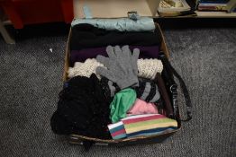 A box full of ladies clothing and accessories including bags, scarves,coats and more.