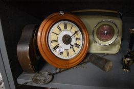 A vintage clock and a Bush radio.