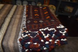 A middle eastern bedouin style hand woven and dyed tent wall hanging blanket