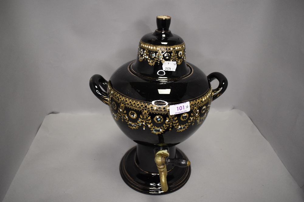 A ceramic tea urn or samovar having gilt and enamel decoration