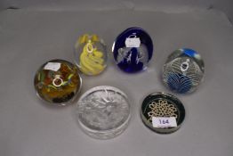 A collection of paperweights.