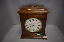 A modern bracket style mantle clock by Knight and Gibbins