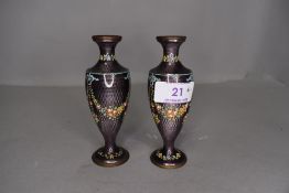 A pair of early 20th Century purple guilloche vases having swag and floral design