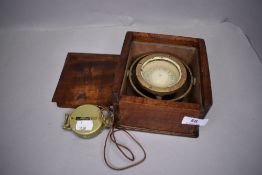 Two compass one pocket sized and a similar naval style cased compass