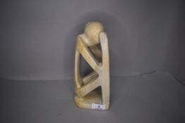 A stone carved modernist style figure sculpture