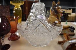 An impressively large cut glass or crystal basket having intricate detailing throughout.