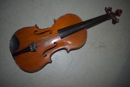 A traditional violin having two piece 14inch tiger stripe back, no case or bow