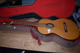 A vintage Framus parlour guitar body, no strings/bridge etc, would make a nice renovation project,