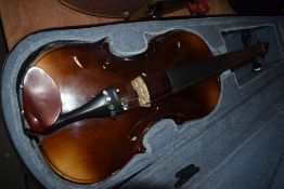 A composite violin, of traditional form, label to body inside made in Czechoslovakia, bridge stamped