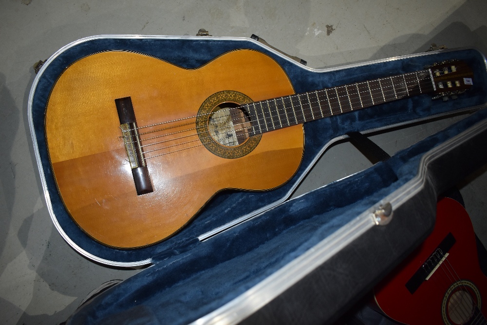 A vintage Kasuga G-160 acoustic guitar , with freestyle hardshell case