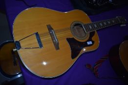 A vintage jumbo Grandesa 12 string guitar