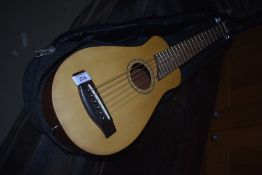 A Johnson JTR-1 travel guitar in soft gig bag