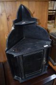 An early 20th century, dark stained corner wall cupboard, w 42cm