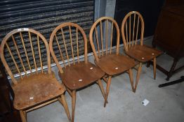 A matched set of four (three and one) hoop and stick back Ercol kitchen dining chairs