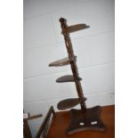 A late 20th century stained frame adjustable plant stand