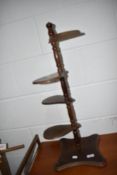 A late 20th century stained frame adjustable plant stand