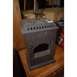 An Edwardian cast iron Albion oil lamp/stove, labelled Rippingilles Patent