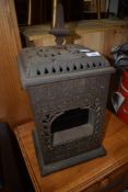 An Edwardian cast iron Albion oil lamp/stove, labelled Rippingilles Patent