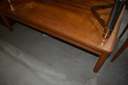 A vintage teak coffee table of large proportions