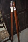 An antique surveyors or similar tripod stand wooden legs with brass fitments