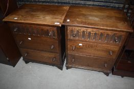 A pair of Priory style oak three drawer bedside chests (Wood Bros)