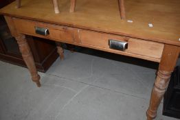 A part pine stripped side table having two frieze drawers, width approx. 114cm, depth 55cm