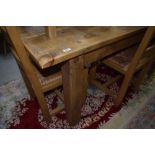 A modern rustic wood kitchen table having rectangular top on heavy square legs, w 152