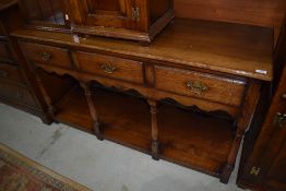 A modern quality reproduction Titchmarsh & Goodwin style dresser base, having 3 frieze drawers