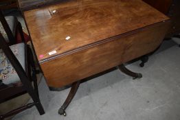 A 19th Century mahogany pembroke style table in the Regency style, width approx. 87cm