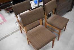 A set of three mid century teak dinning chairs