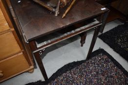 A 19th century mahogany side table having drop flap top, with false drawer front and square