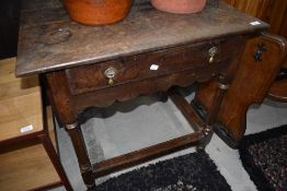 A 19th century oak side table in the Jacobean style, having frieze drawer and turned legs, w 80cm