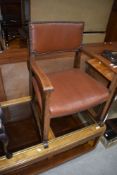 An early/mid C20th oak frame low seat armchair