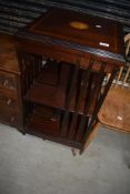 A reproduction Edwardian style revolving bookcase