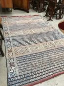 A traditional ethnic style carpet square approx. 280 x 190cm
