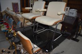 A 1970's smoke glass top and chrome frame dining table, w 145cm, and a set of designer laminate