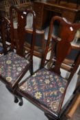 A pair of early C20th mahogany Q Anne style dining chairs