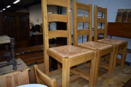 A set of 6 modern rubber wood dining kitchen chairs having rush seats