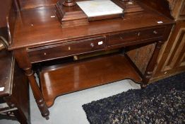 A 18th century mahogany washstand having raised ledge back, with 2 frieze drawers on turned legs and
