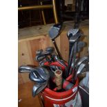 A selection of traditional golf clubs, in Wilson golf bag, and similar clubs