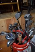 A selection of traditional golf clubs, in Wilson golf bag, and similar clubs