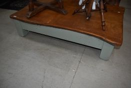 A modern bespoke oak top low coffee table on painted stub legs, w 123cm