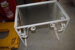 A garden table with glass top